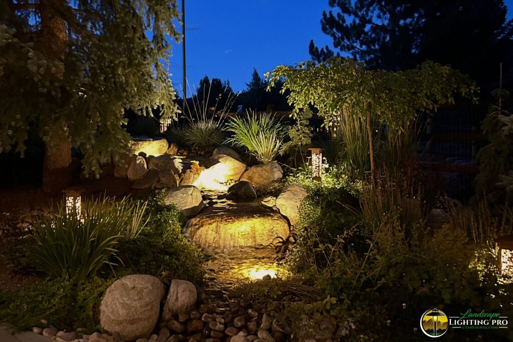 water feature with a lit waterfall